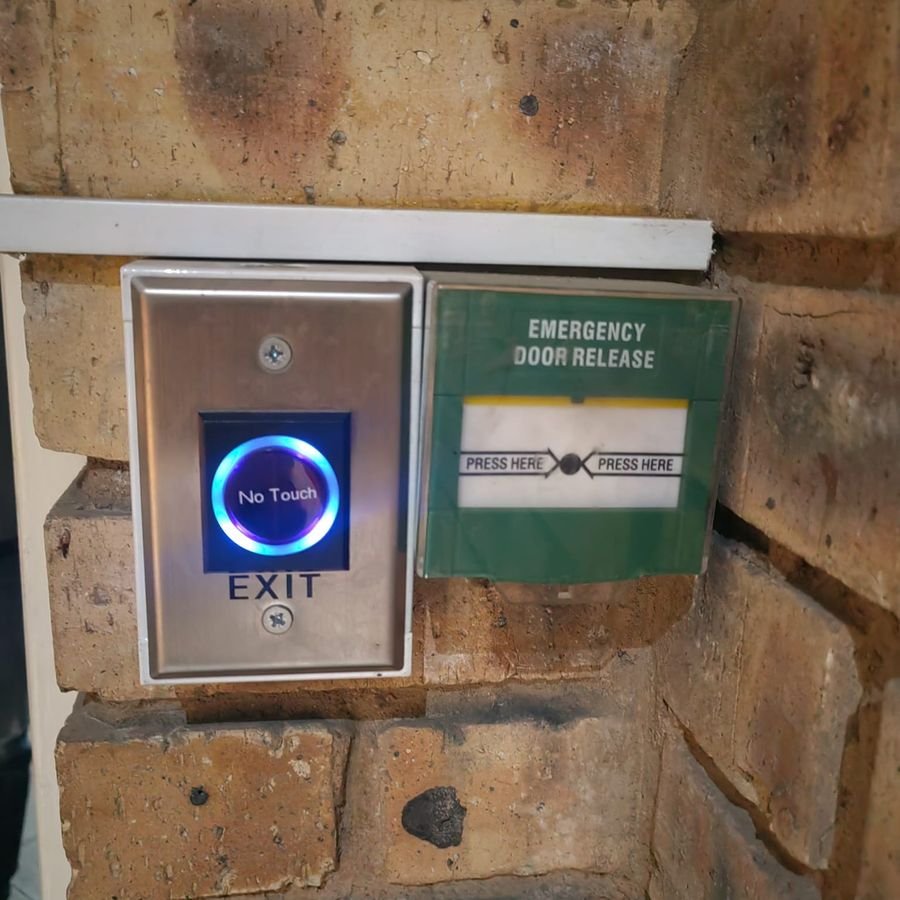 Touchless exit button and emergency door release